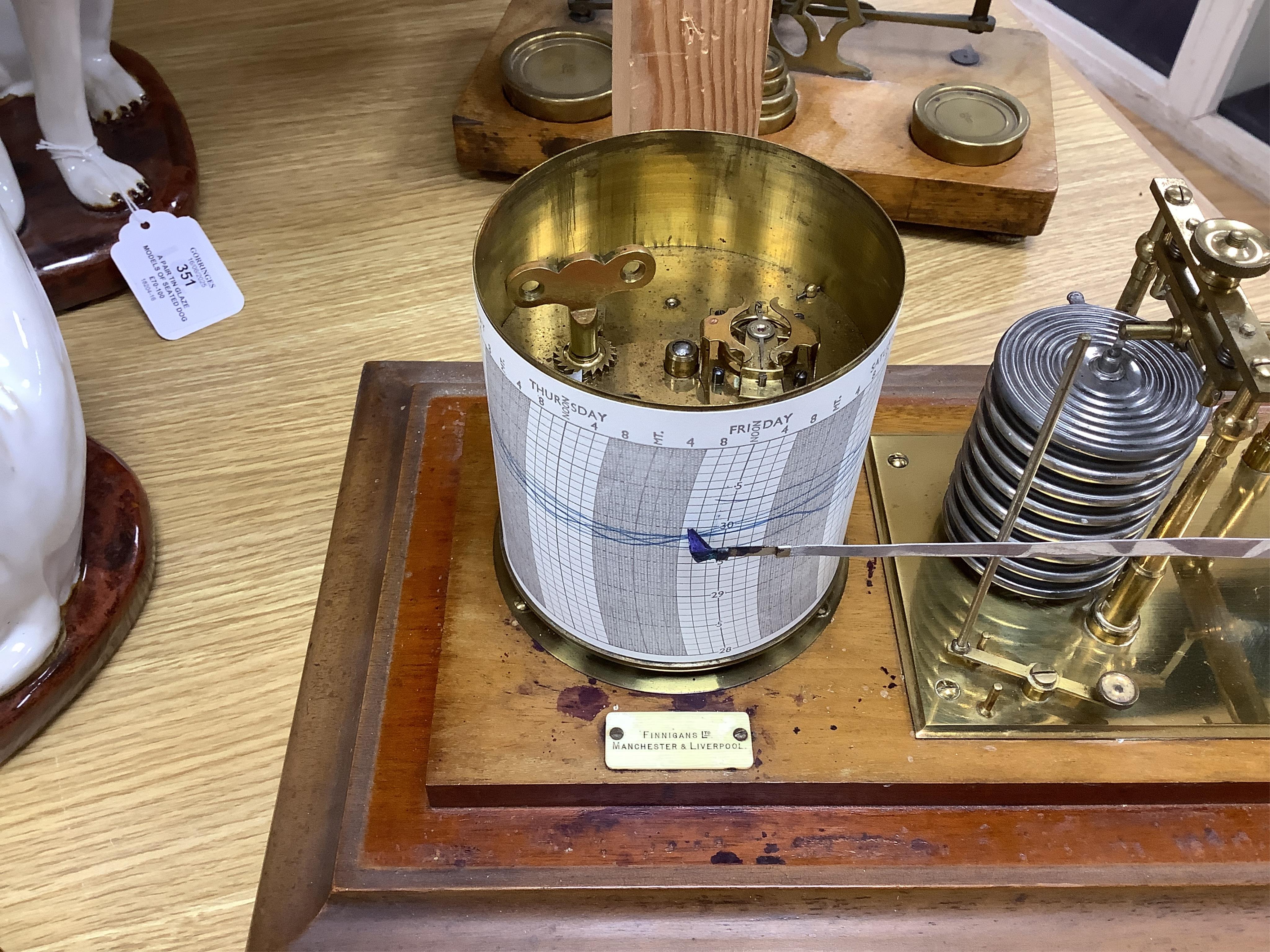 An early 20th century oak cased barograph by Finnigans Ltd., Manchester & Liverpool, with integral drawer underneath containing spare papers